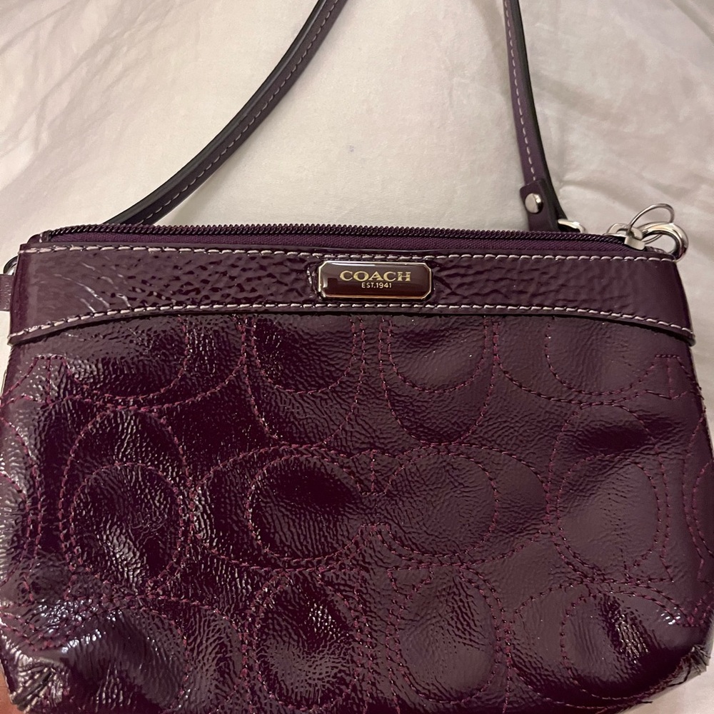 Coach Burgundy Clutch with Signature Embossed Design